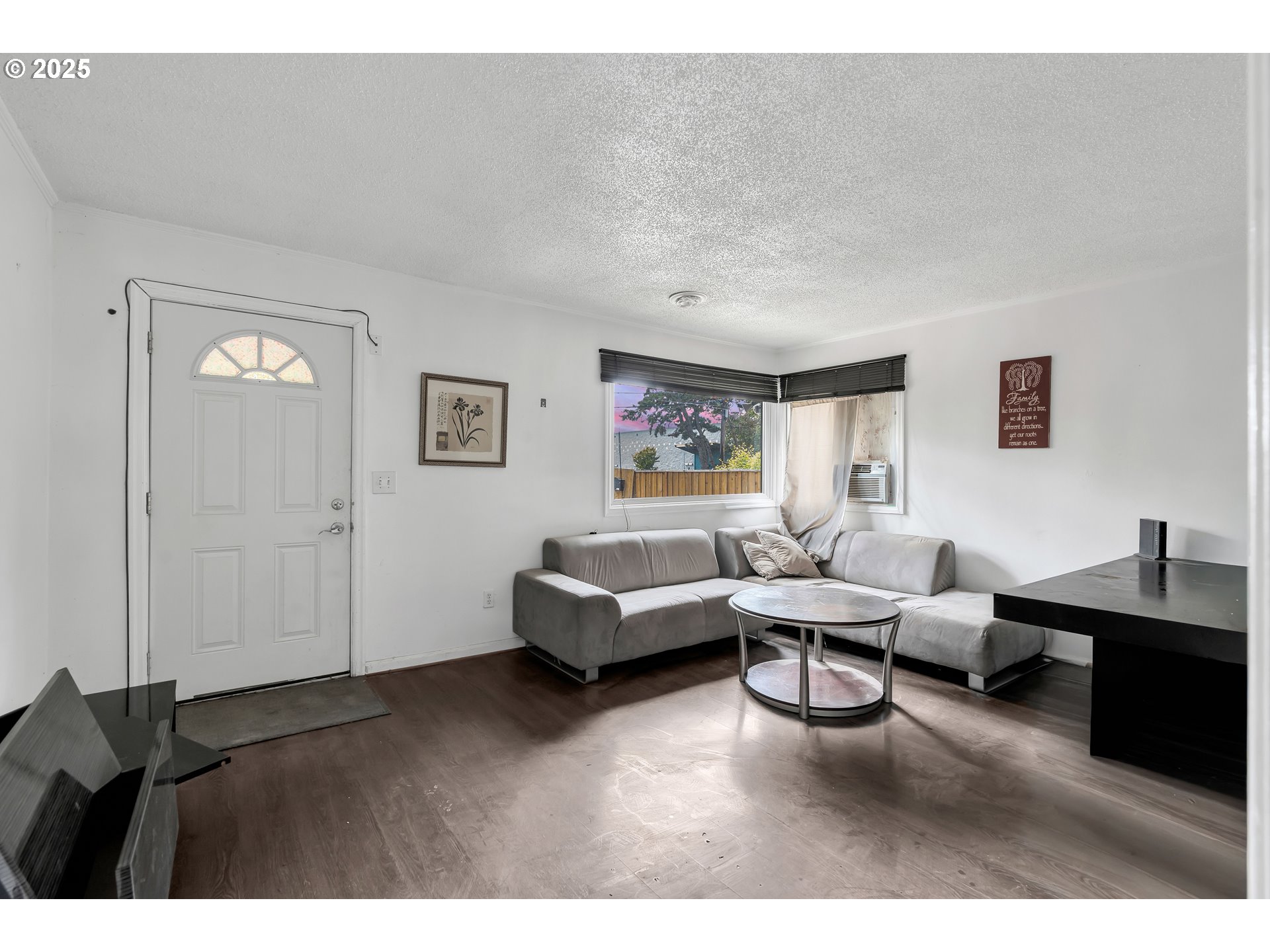 8451 Southeast Bush Street Portland, OR 97266 - Photo 6 of 47 a living room with furniture and a flat screen tv