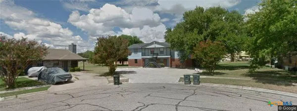 a building with trees in front of it