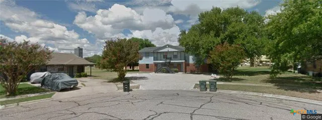 a building with trees in front of it