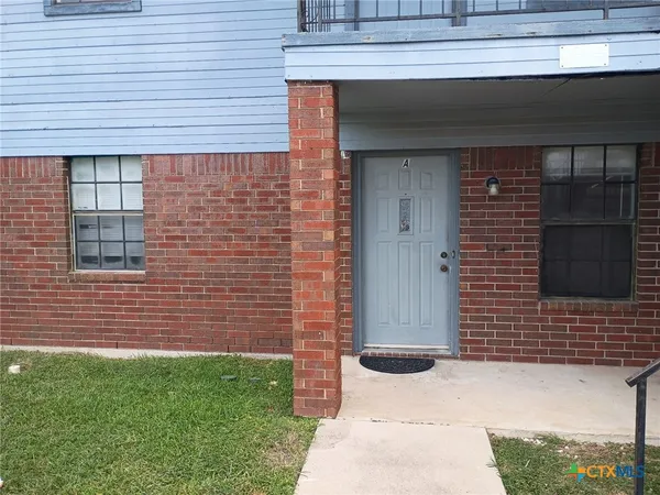 a brick house with a door