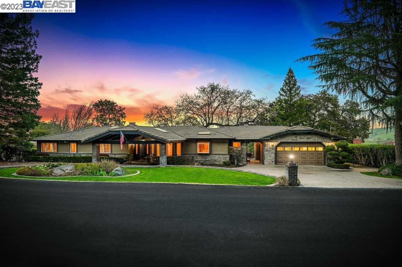 42 Golf Road Pleasanton, CA 94566 - Photo 1 of 1 a front view of a house with a garden