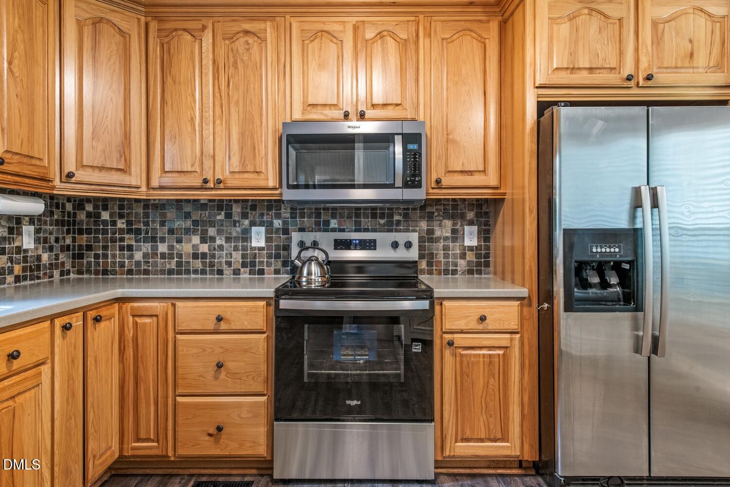 134 Longview Road Madison, NC 27025 - Photo 13 of 49 a kitchen with stainless steel appliances granite countertop a stove and a microwave