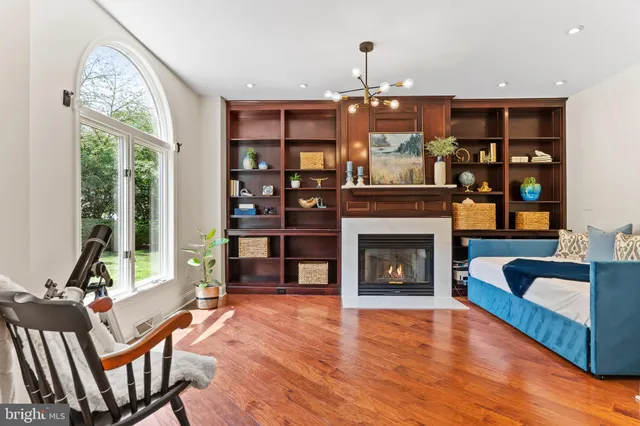 a dining room with furniture window and wooden floor