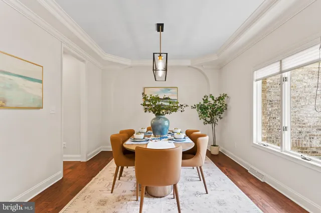 a living room with furniture fireplace and a large window