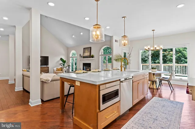 a kitchen that has a table and chairs in it
