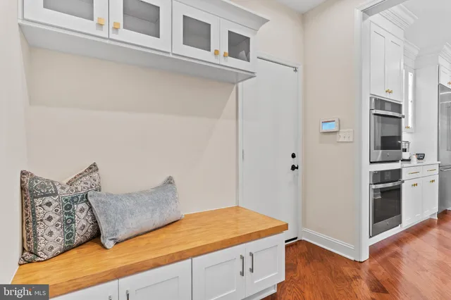 a bathroom with a sink tub shower and glass door