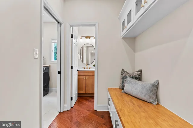 a white bath tub sitting next to a bathroom sink