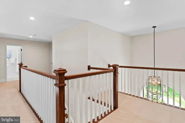 a bedroom with a bed and a night stand