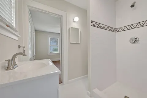 a bathroom with a sink and mirror