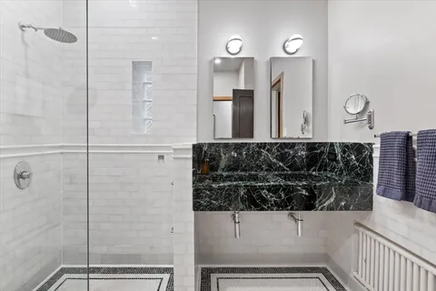 a bathroom with a bathtub and shower