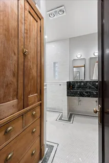 a bathroom with a tub and a shower