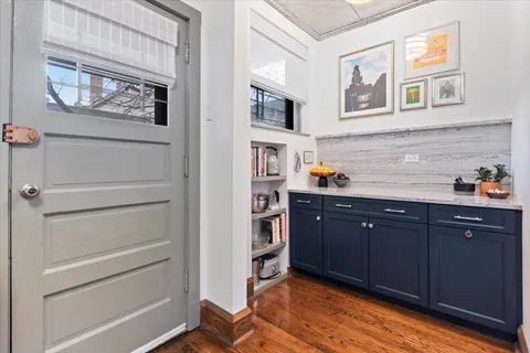 a kitchen with a stove top oven sink and cabinets
