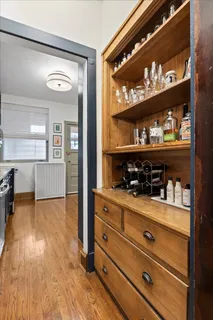 a view of a bedroom with cabinet cabinet and window