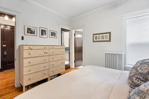 a view of a chairs and table on the wooden floor