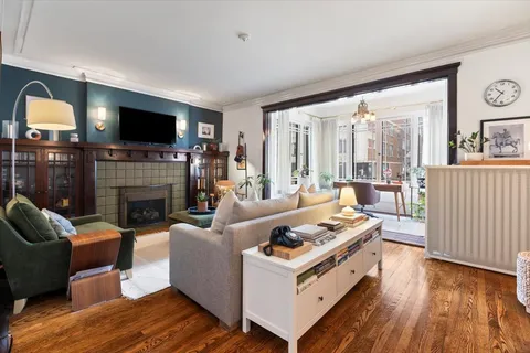 a living room with furniture fireplace and flat screen tv