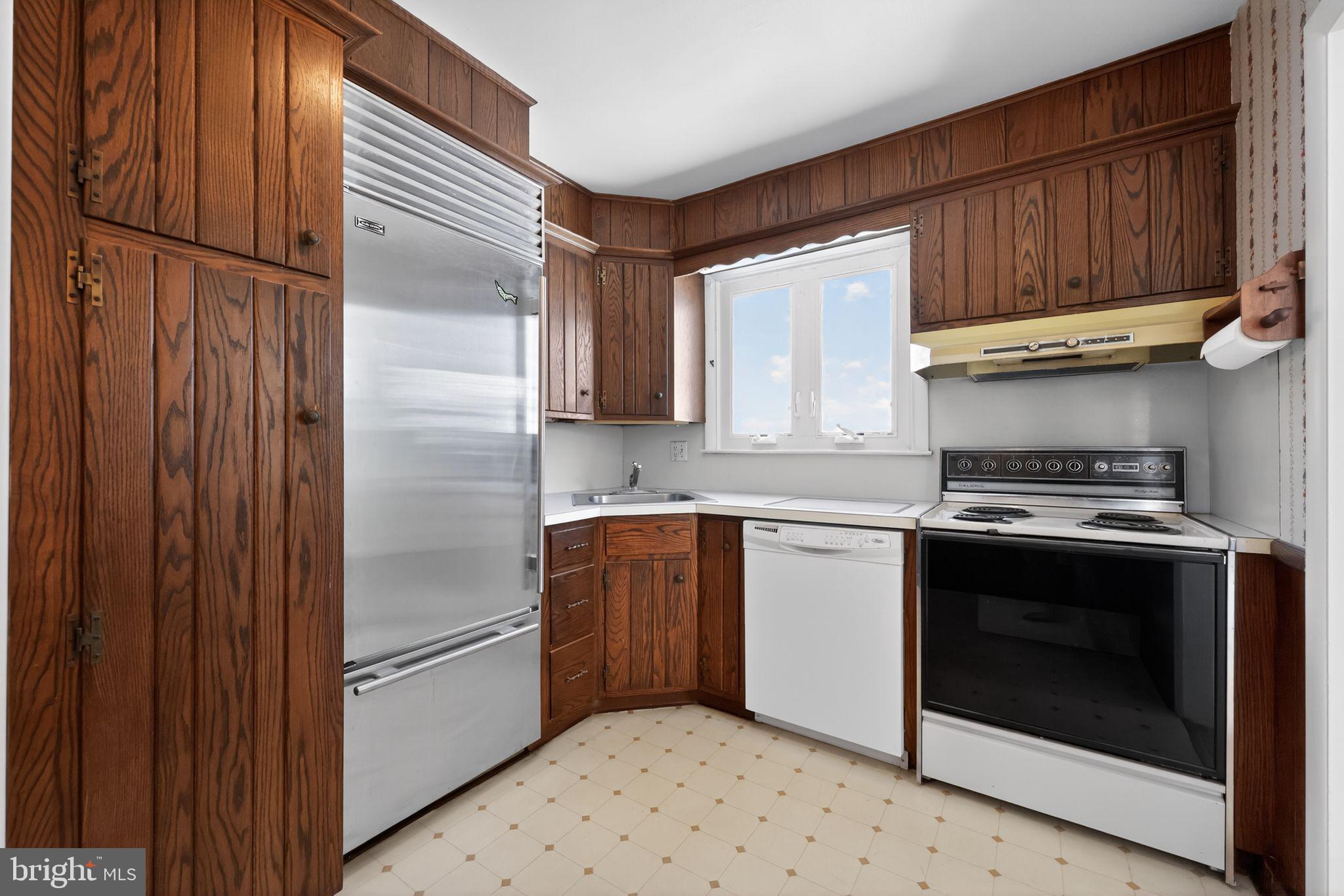 205 Willard Road Hatboro, PA 19040 - Photo 14 of 30 a kitchen with stainless steel appliances granite countertop a refrigerator stove and sink