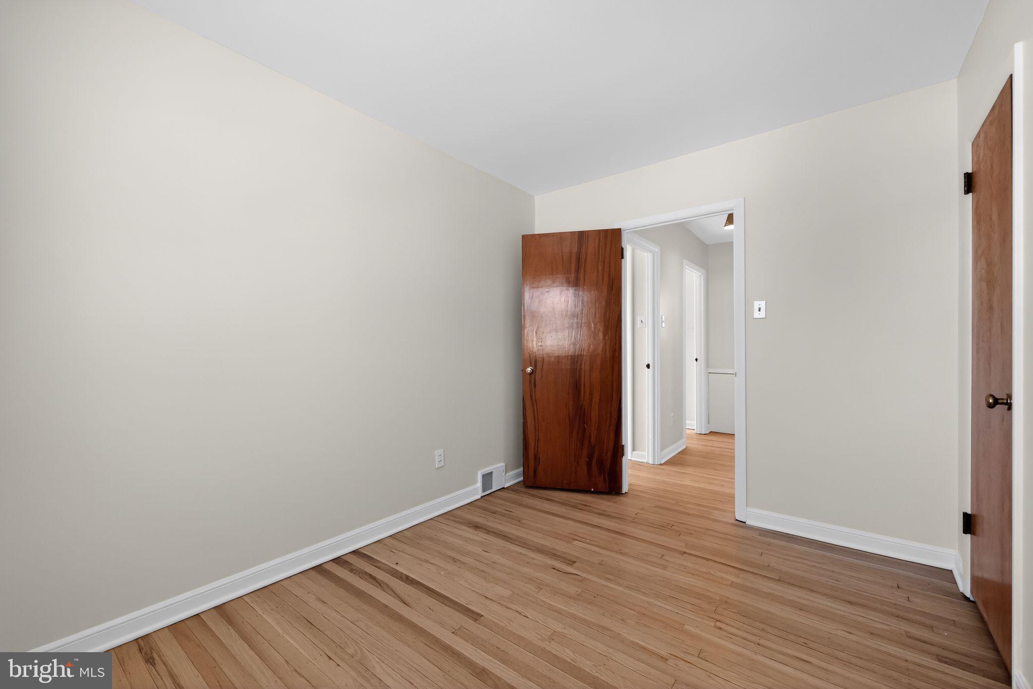 205 Willard Road Hatboro, PA 19040 - Photo 24 of 30 a view of an empty room with wooden floor and closet