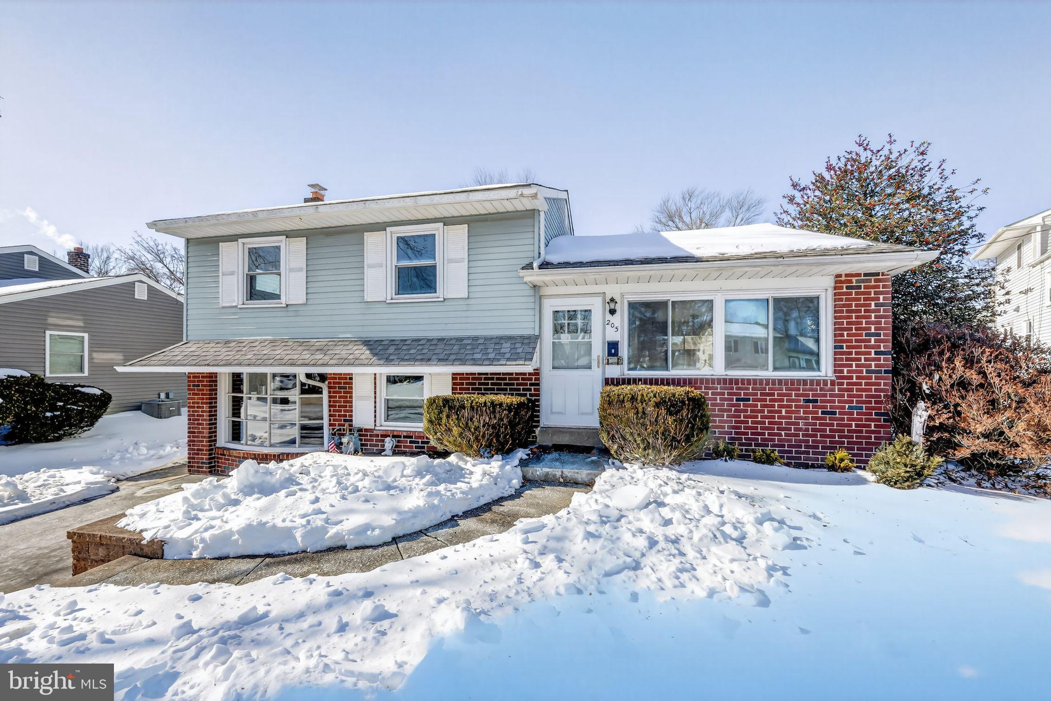 205 Willard Road Hatboro, PA 19040 - Photo 29 of 30 a front view of a house with a yard outdoor seating and covered with trees