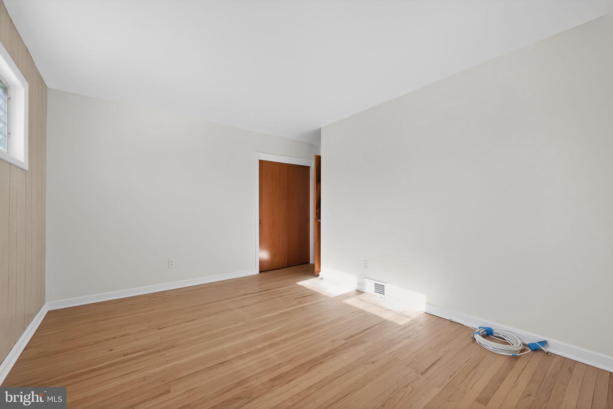 205 Willard Road Hatboro, PA 19040 - Photo 7 of 30 a view of an empty room with wooden floor