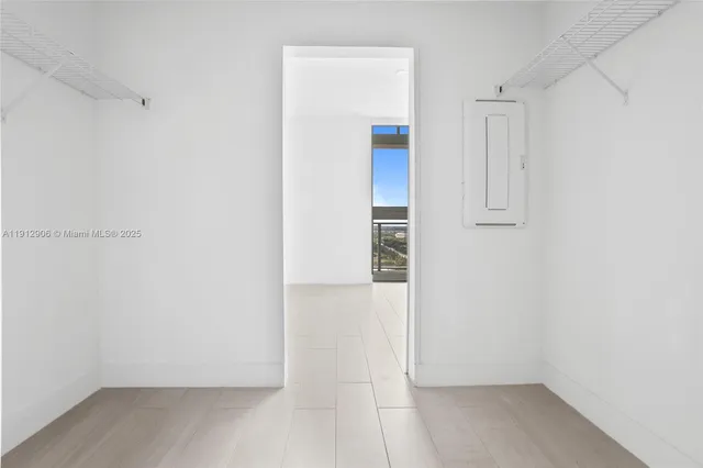 a view of an empty room and window