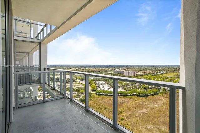 a view of a glass door and a balcony