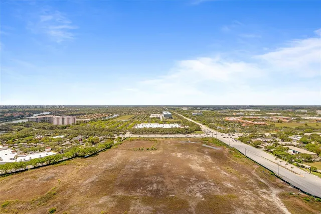 an aerial view of residential building and ocean view
