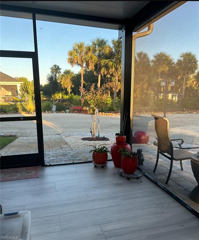 3486 40th Avenue Southeast Naples, FL 34117 - Photo 14 of 50 a dining room with wooden floor