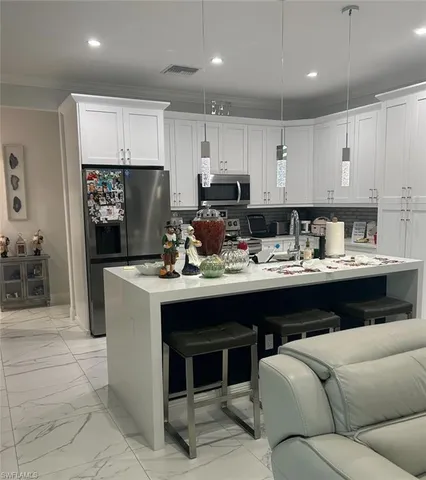 a kitchen with a sink cabinets and window