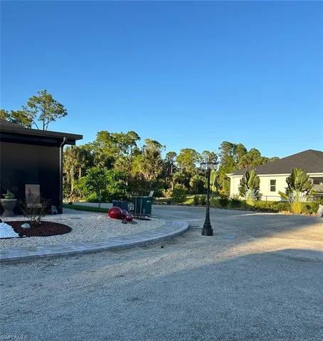a view of a street with a garage