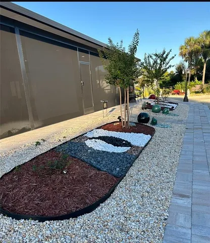 a view of a backyard of the house