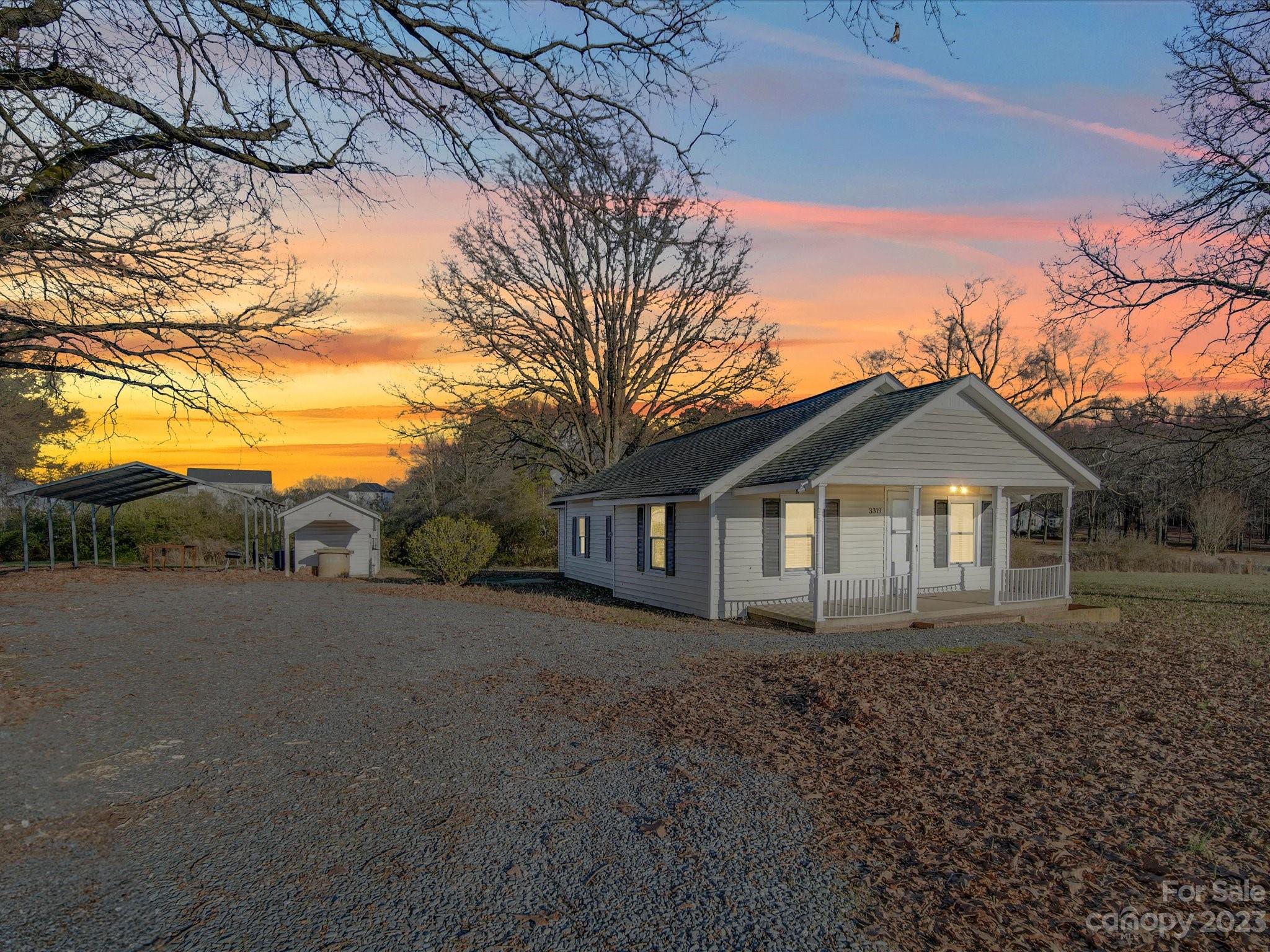 3319 Stack Road Monroe, NC 28112 - Photo 1 of 45 a big house with a big yard and large trees
