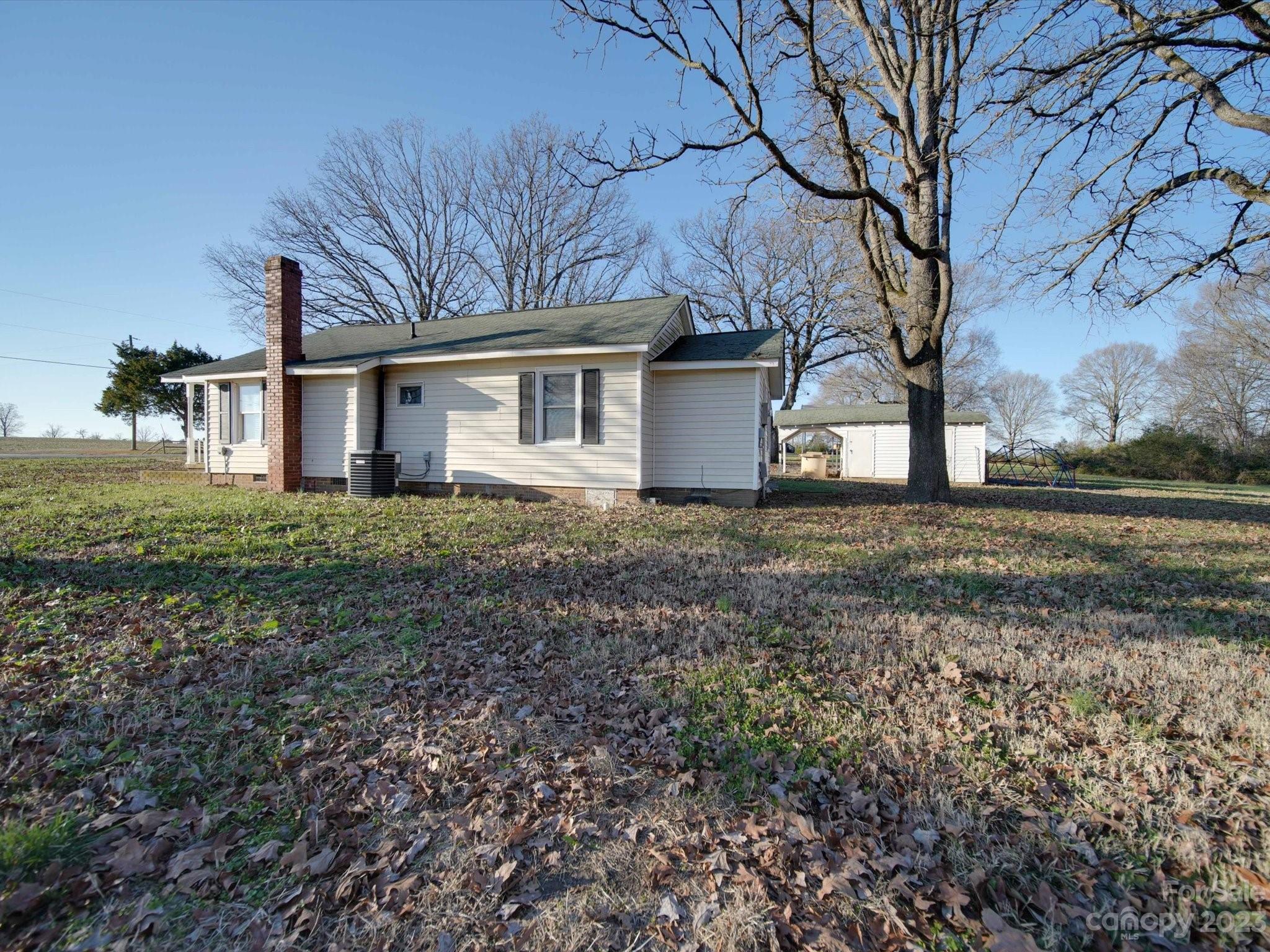 3319 Stack Road Monroe, NC 28112 - Photo 13 of 45 a white house that has a tree in front of it