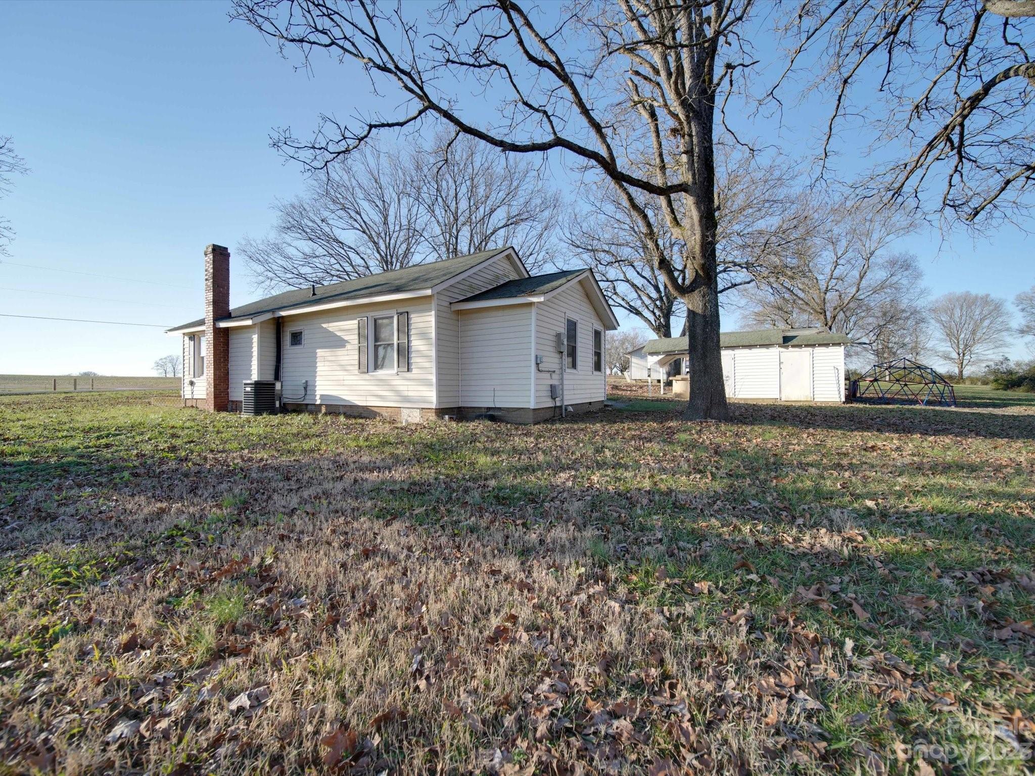 3319 Stack Road Monroe, NC 28112 - Photo 14 of 45 a white house that has a tree in front of it