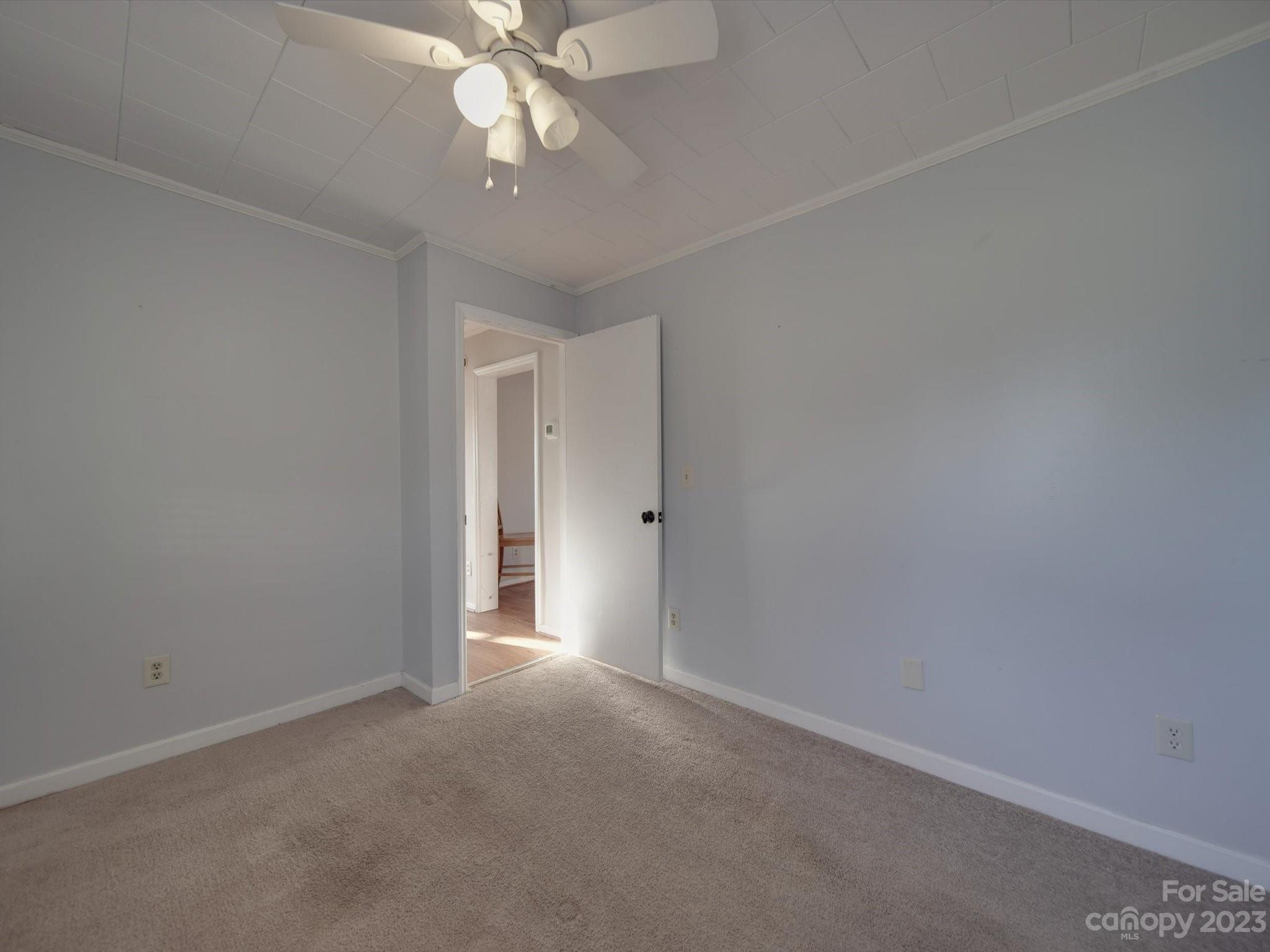 3319 Stack Road Monroe, NC 28112 - Photo 19 of 45 a view of an empty room with a fan