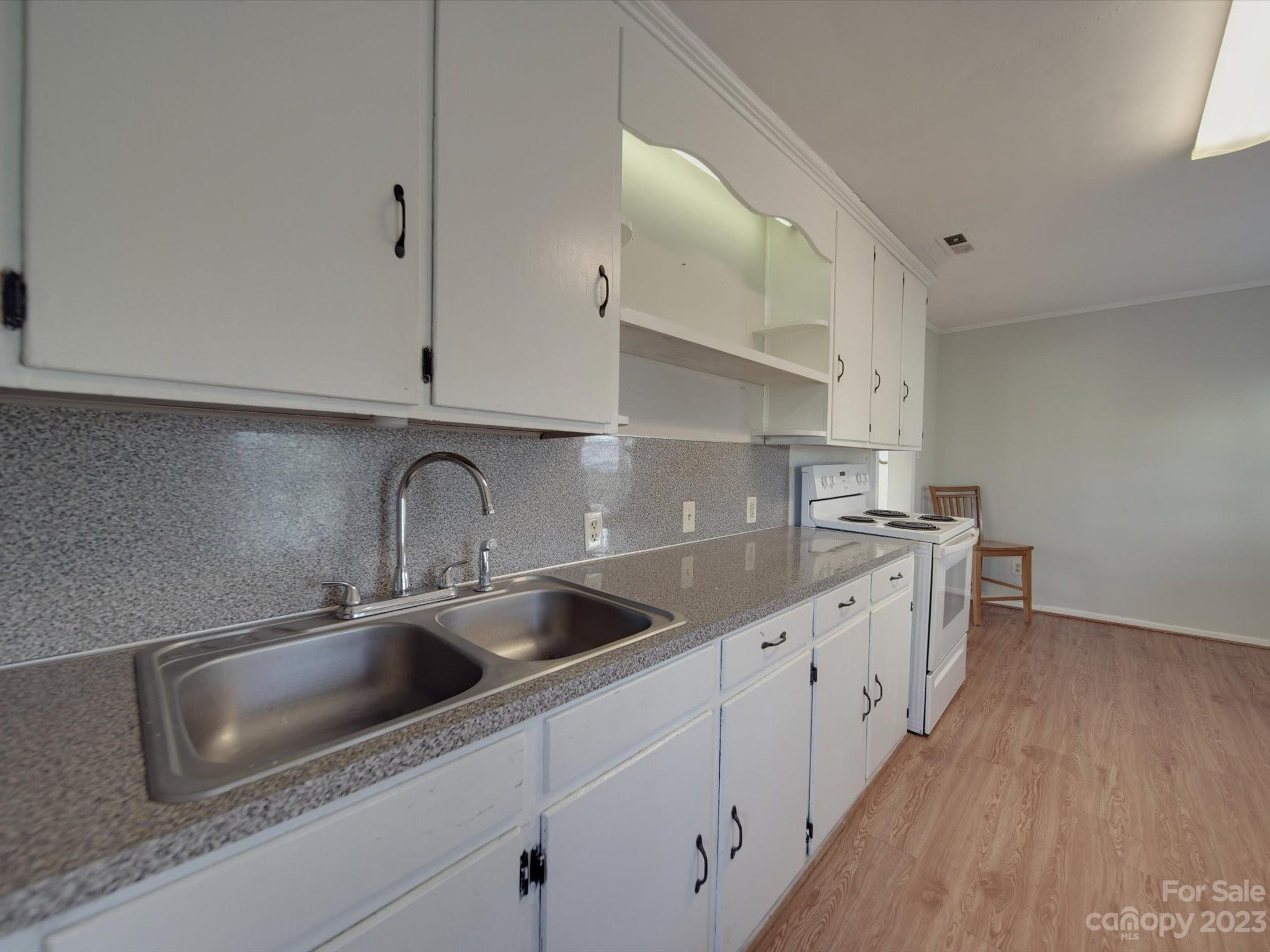 3319 Stack Road Monroe, NC 28112 - Photo 23 of 45 a kitchen with stainless steel appliances granite countertop a sink and cabinets