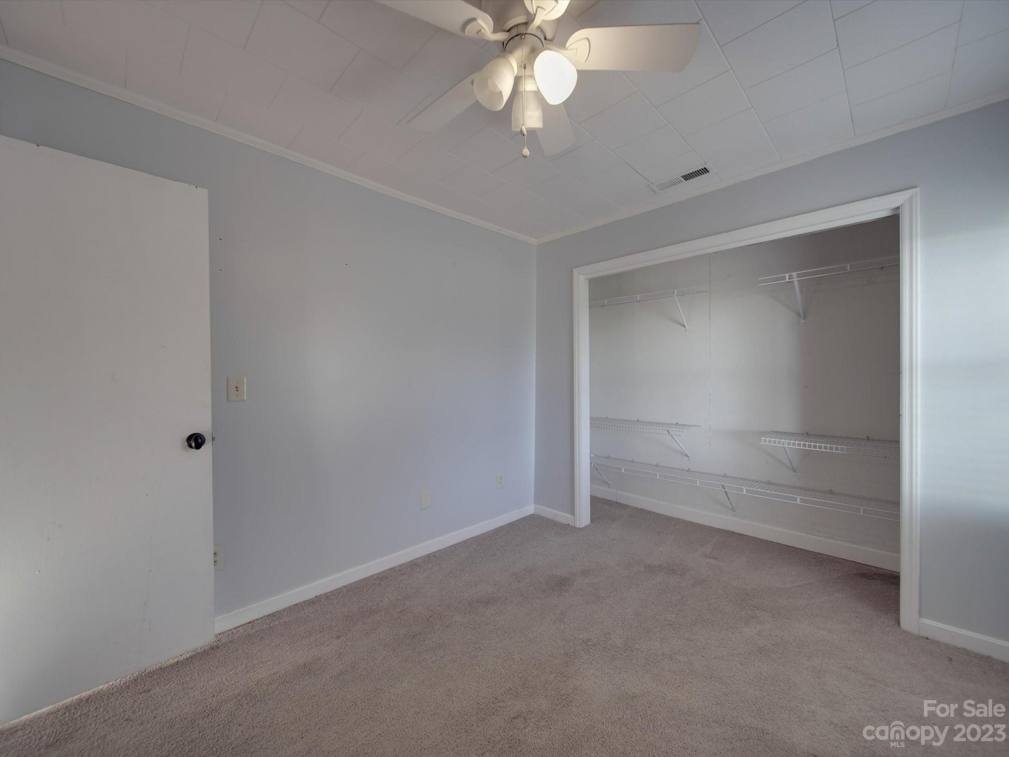 3319 Stack Road Monroe, NC 28112 - Photo 27 of 45 an empty room with a empty space and a ceiling fan