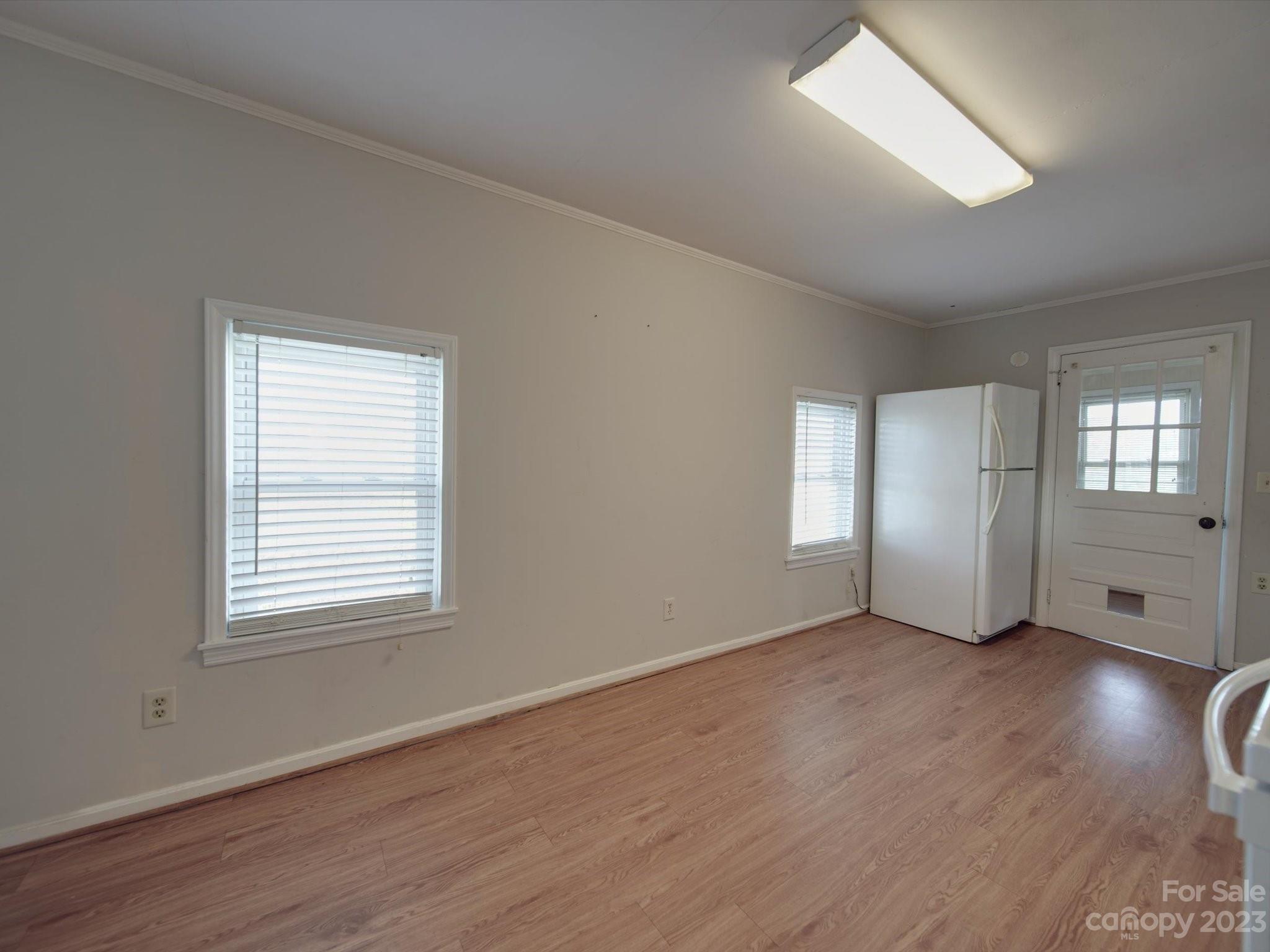 3319 Stack Road Monroe, NC 28112 - Photo 30 of 45 a view of an empty room with wooden floor and a window