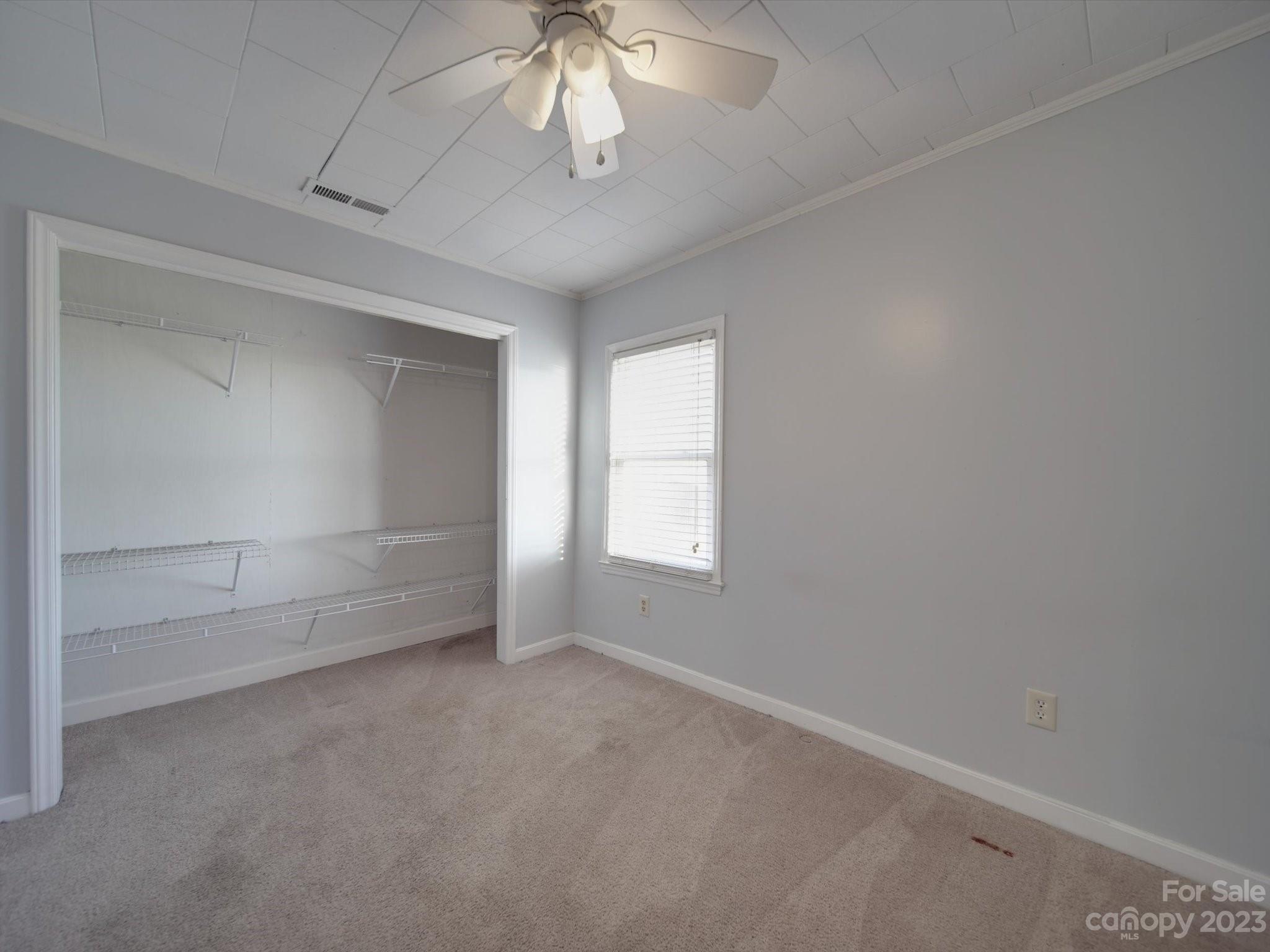 3319 Stack Road Monroe, NC 28112 - Photo 39 of 45 an empty room with a empty space and a ceiling fan