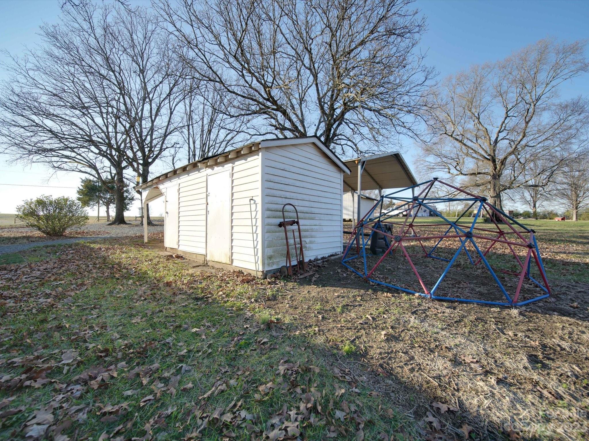 3319 Stack Road Monroe, NC 28112 - Photo 8 of 45 a backyard of a house with table and chairs