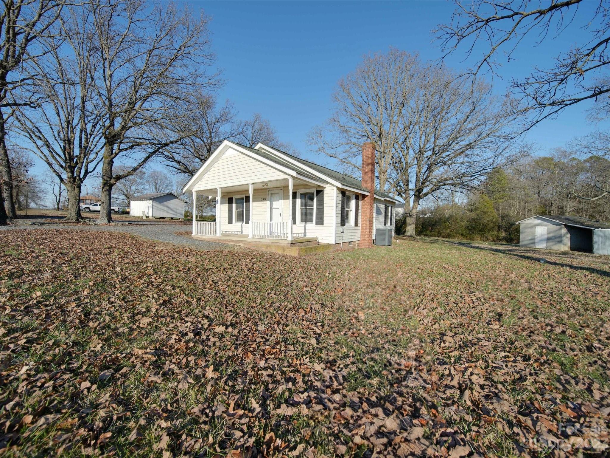 3319 Stack Road Monroe, NC 28112 - Photo 10 of 45 a front view of a house with a yard