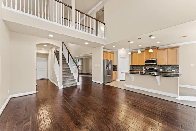a spacious bathroom with a granite countertop tub sink and mirror