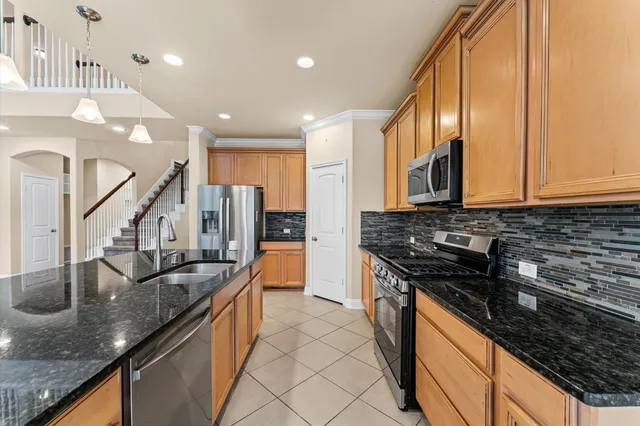 an aerial view of multiple houses with yard