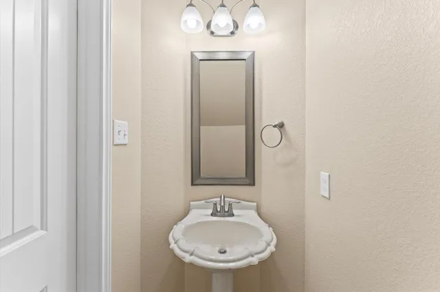a picture of a bathroom with a shower