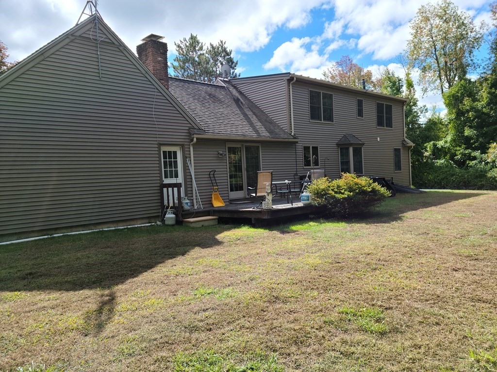 63 Hobbs Road Princeton, MA 01541 - Photo 1 of 1 a front view of a house with a yard and garage
