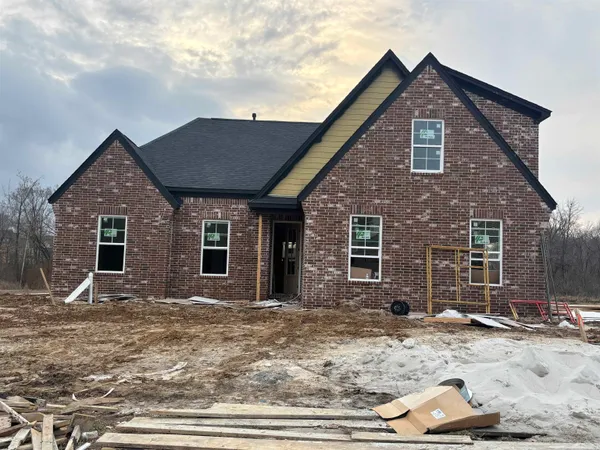 a front view of a house with yard