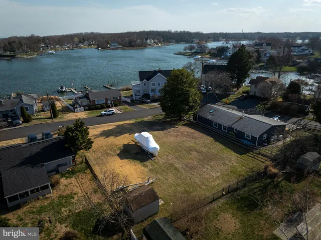 an aerial view of a house with a lake view