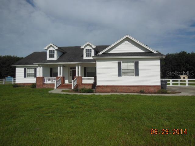 15148 Evans Ranch Road Lakeland, FL 33809 - Photo 1 of 1 a front view of a house with a yard