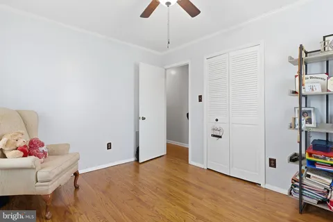 a bedroom with a bed and windows