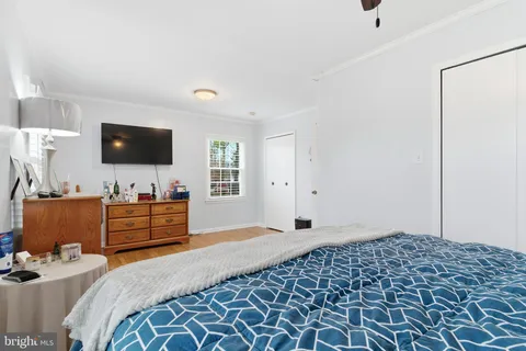 a bathroom with a sink a toilet and shower curtain