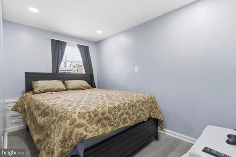 a bedroom with a bed and a bookshelf